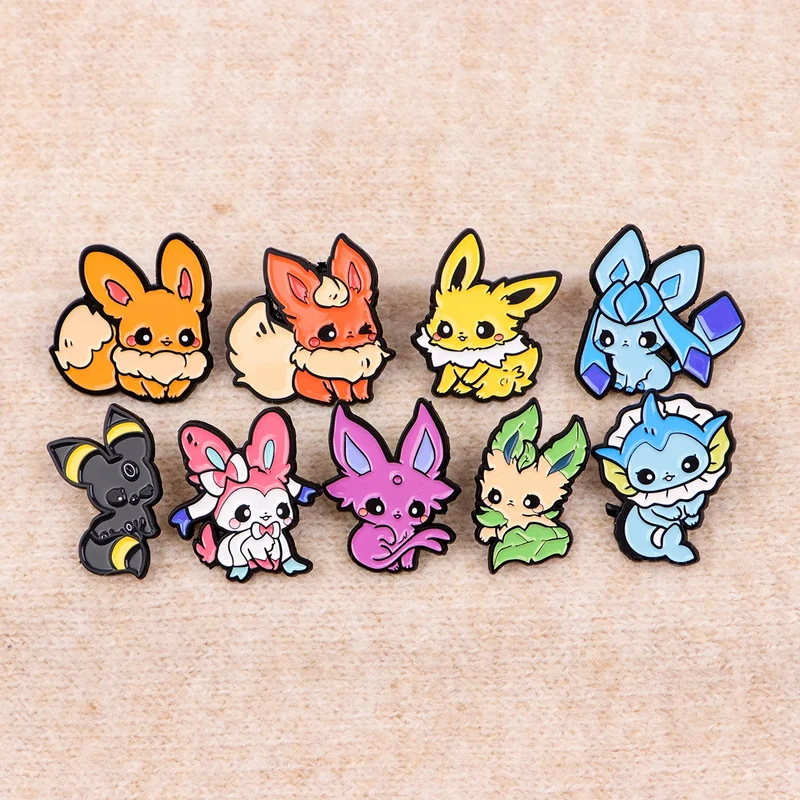 Pins et badges représentant les évolutions mignonnes d'Évoli
