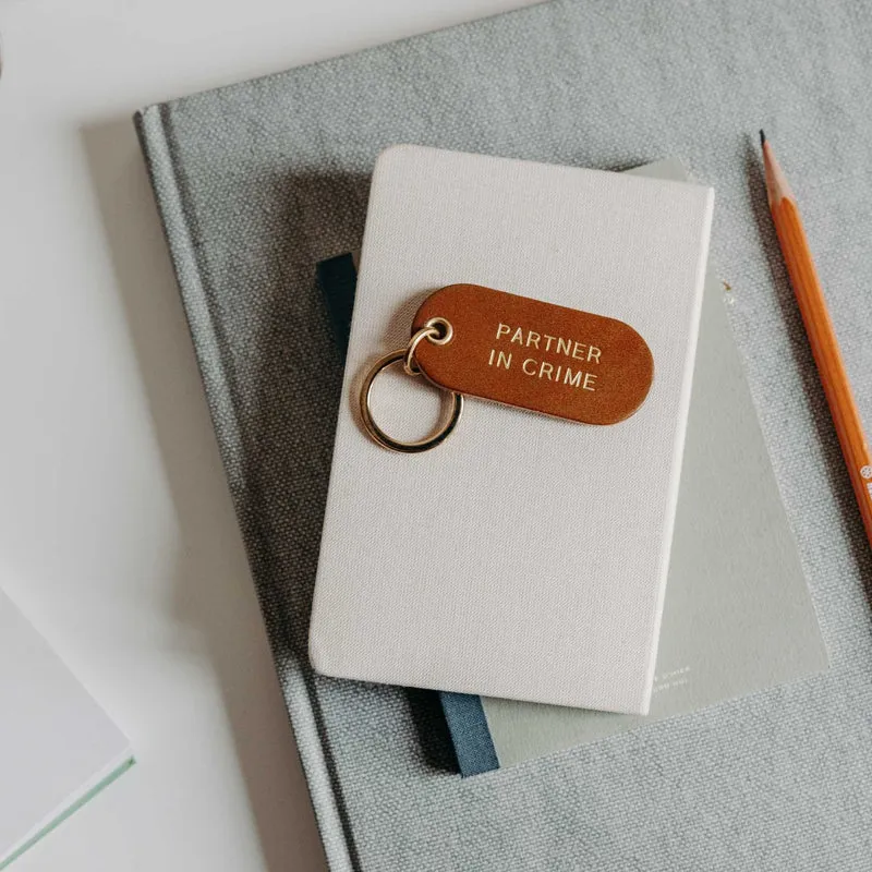 Porte-clé à message en cuir
